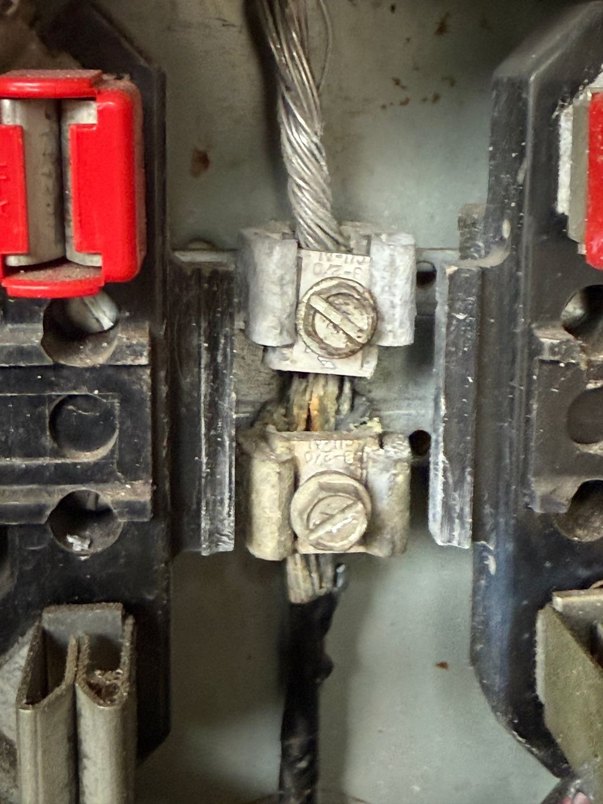 Corrosion and damaged strands at an old meter socket connection, the kind of problem we replace before it fails.